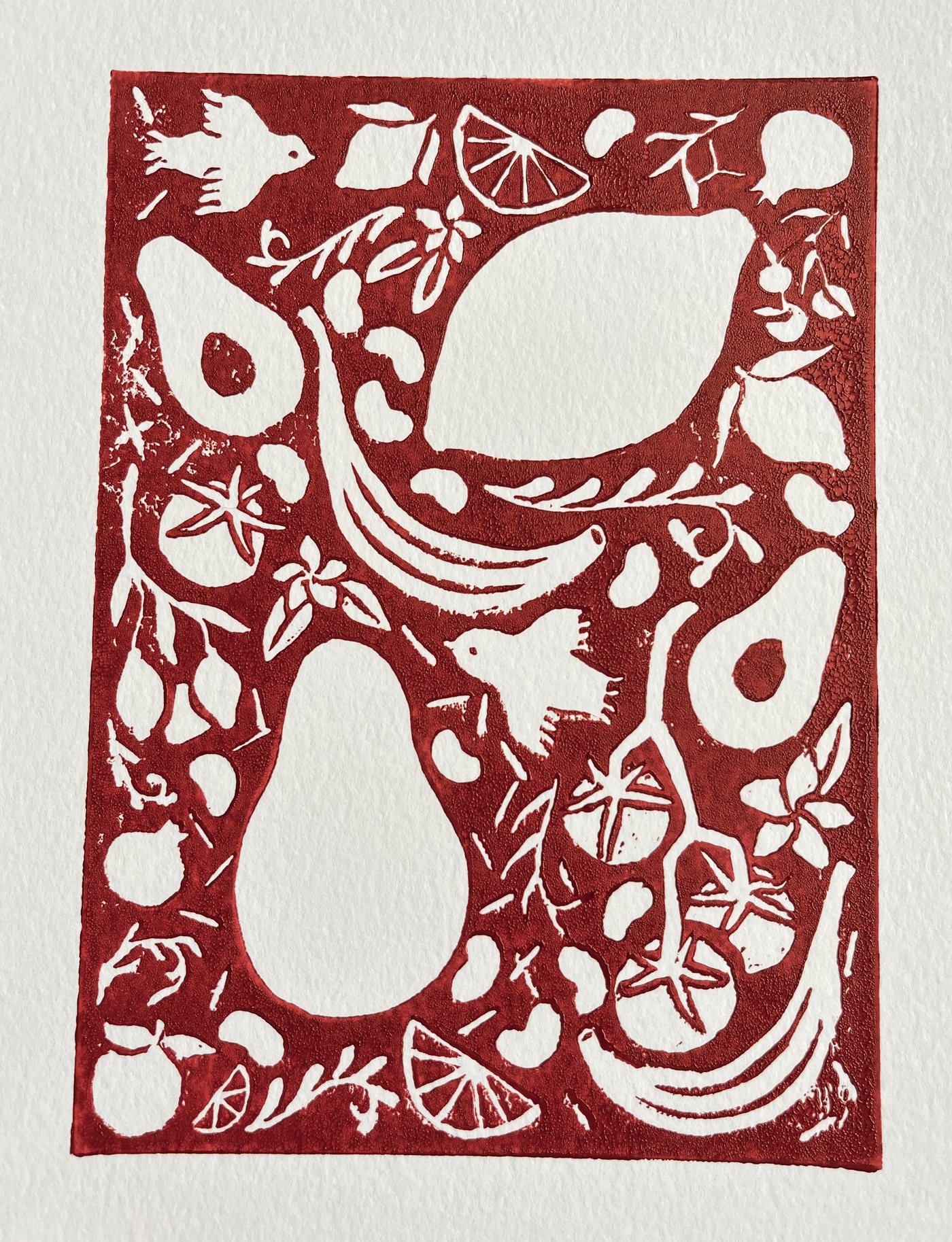 Linocut wedding invitation: birds, pears, avocados, citrus and olive branches carved in red on cream paper